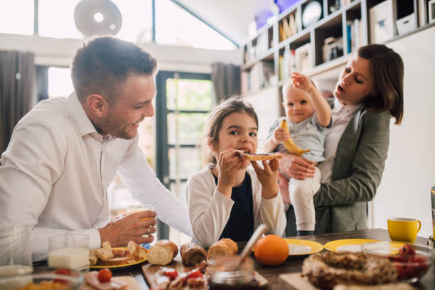 istock Young family enjoying their meal 1165518292