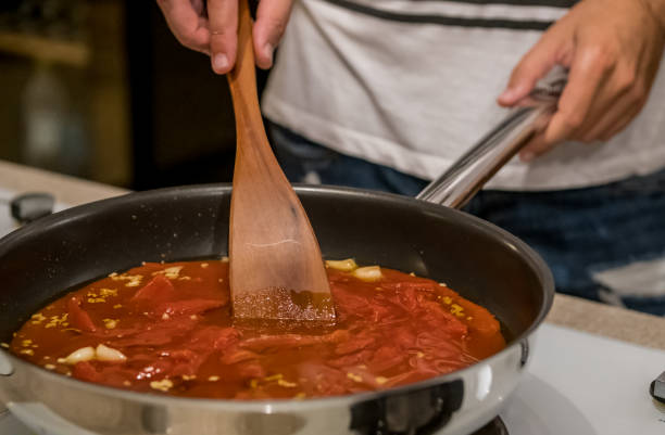 istock Tomato sauce is prepared to cook for spaghetti or pasta 1165518393