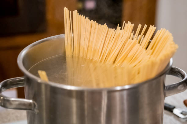 istock Spaghetti boiling in hot water on the stove 1165519447