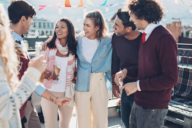 istock Group of friends chatting on a balcony 1165519472