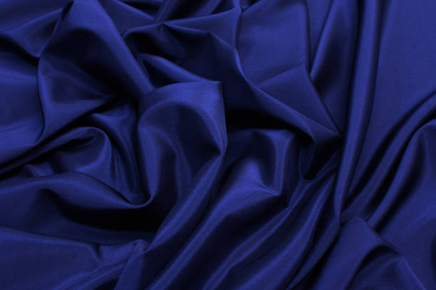 istock The texture of the synthetic fabric is dark blue. Background, pattern. 1165519666
