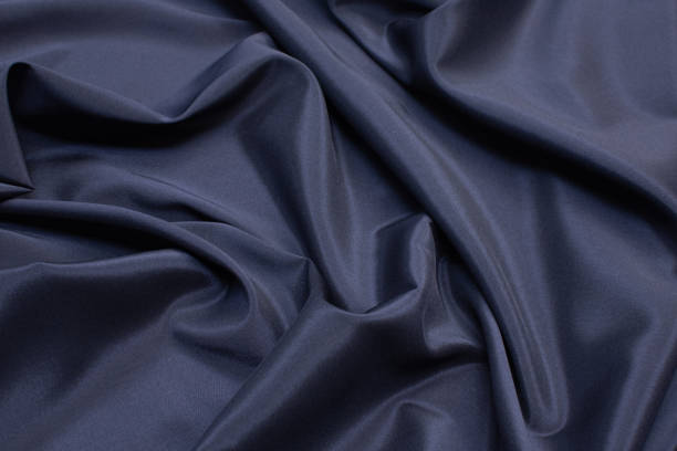 istock The texture of the synthetic fabric is dark blue. Background, pattern. 1165519669