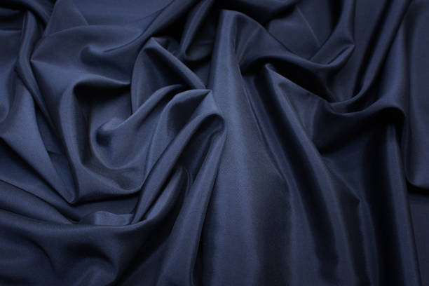 istock The texture of the synthetic fabric is dark blue. Background, pattern. 1165519678