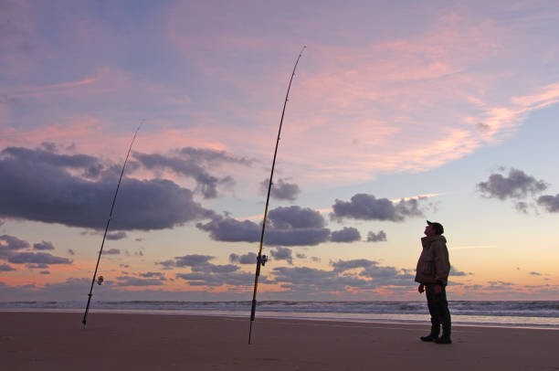 istock sea fishing scene at sunset 1165519869