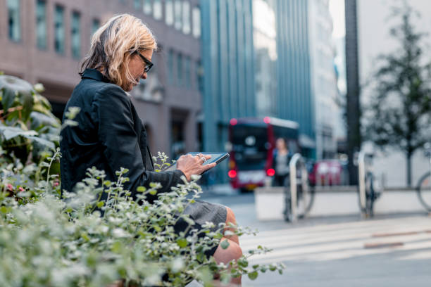 istock Woman always working on the way 1165521403