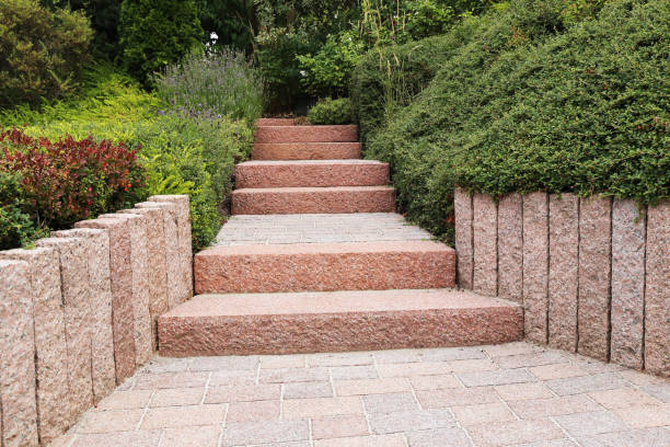 istock Neat and tidy front yard with solid block steps, decorative gravel and planting 1165521734
