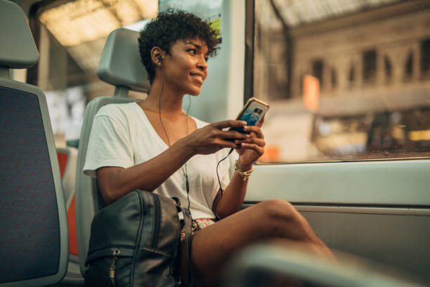 istock Beautiful woman riding in train 1165523256