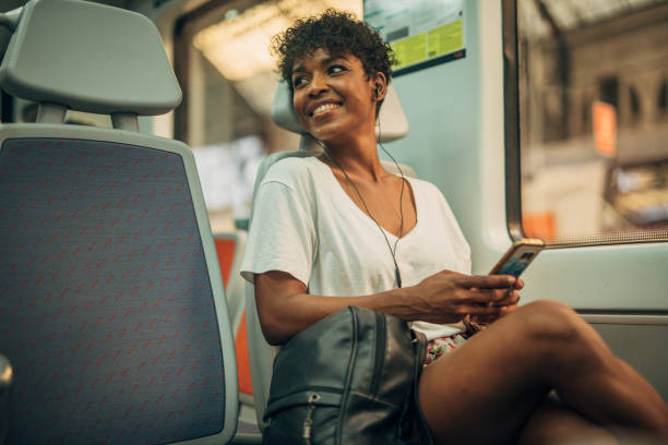 istock Beautiful lady riding in train 1165523273