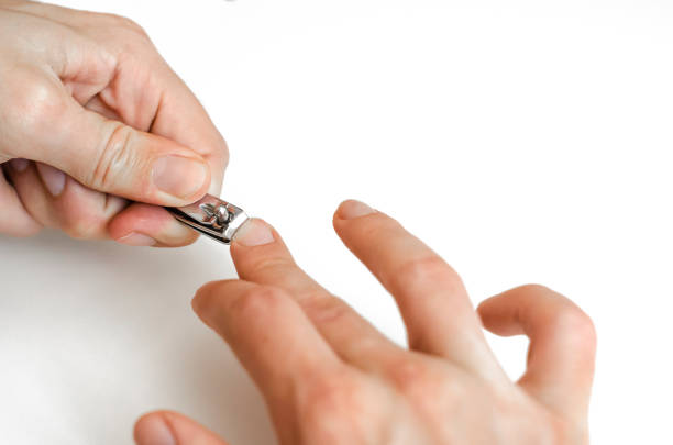 istock A young man does a manicure. Photo. 1165525221