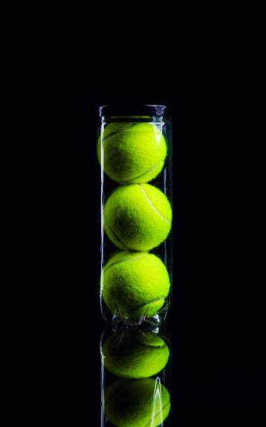 istock Tennis Ball isolated on black with dramatic lighting 1165527871