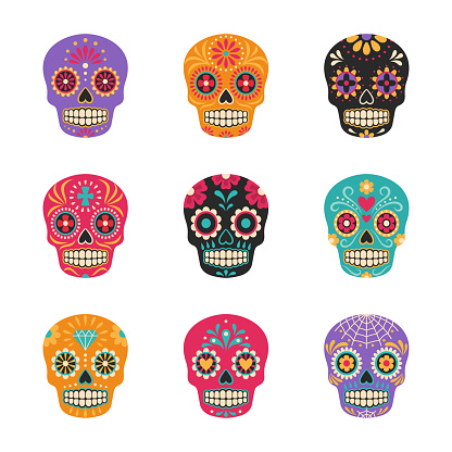 Vector collection of Mexican traditional sugar skulls in various colors. Isolated on white.