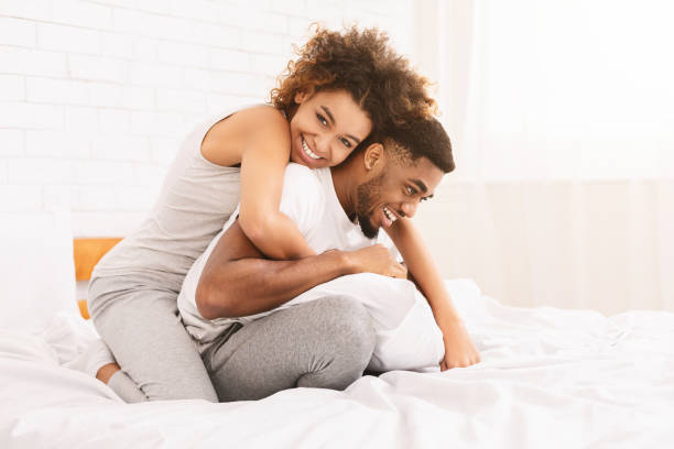 istock Young loving couple having romantic times in bedroom 1165530907