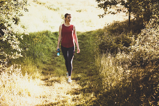 woman walking in the nature to relax and distress