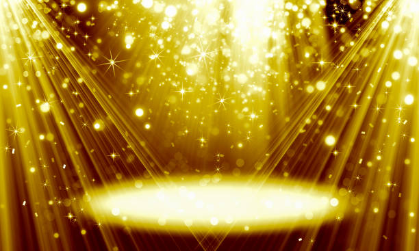 istock Bright gold background, holiday, scene, rays, light effect, fun, celebration, birthday, Christmas, radiance, glitter, bokeh, yellow, black, glare, stars 1165536363