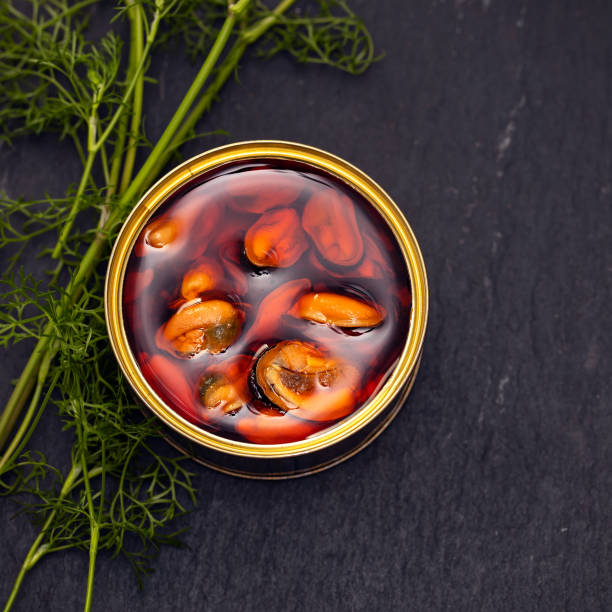 istock mussels in small iron box on black ceramic background 1165536746