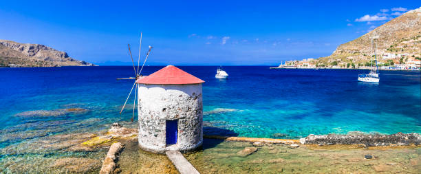 Traditional authentic Greece - beautiful island Leros in Dodecanese, view with old windmill over the sea