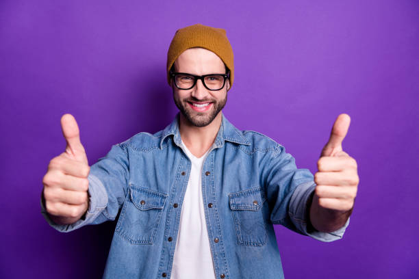 istock Close-up portrait of his he nice attractive confident cheerful cherry optimistic, bearded guy showing two thumbs up sale discount isolated over bright vivid shine violet lilac background 1165538358