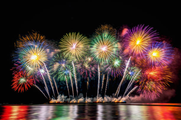 istock Amazing Colorful Fireworks exploding for Celebration from the big boat over the sea, celebration and happy new year and merry christmas festival concept 1165540985