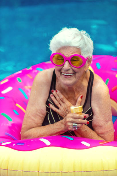 プールで84歳のシニア女性 - female 80 plus years vertical people ストックフォトと画像