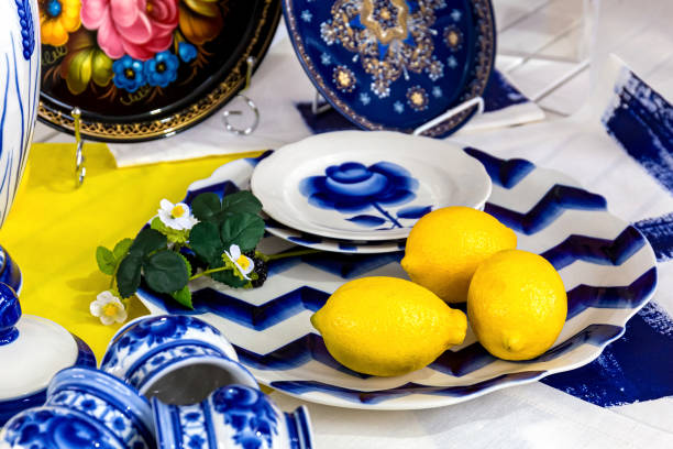 istock Composition with lemons on a blue plate.Fresh yellow lemons 1165548327