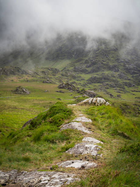istock Path on misty mountains in ireland 1165548395