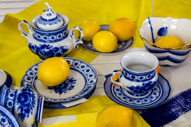 istock Composition with lemons on a blue plate.Fresh yellow lemons 1165548619