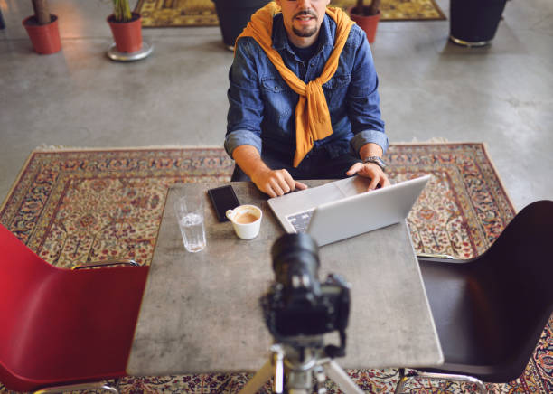 istock Young man making a video blog 1165549453