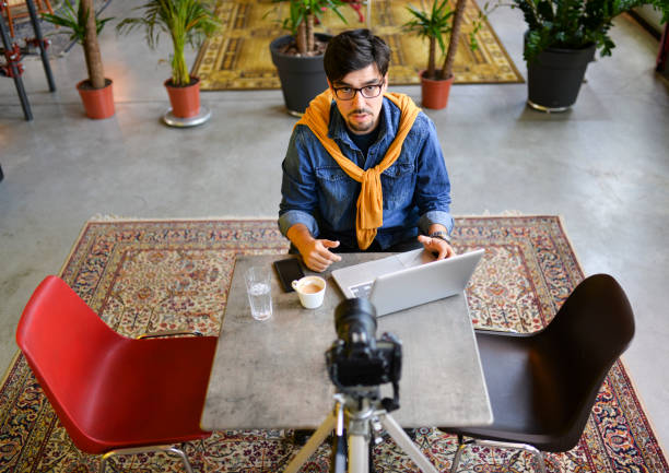 istock Young man making a video blog 1165549681