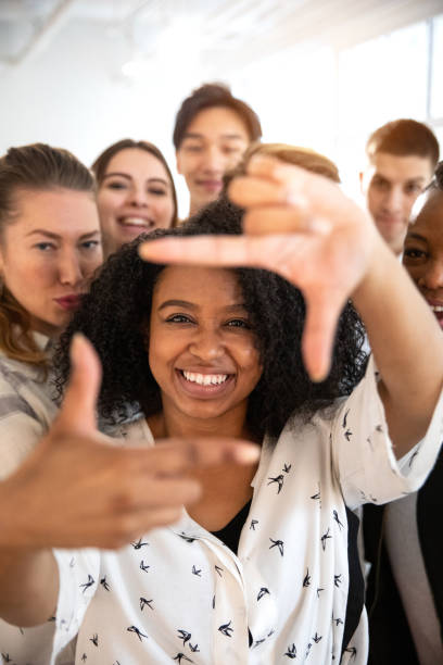 istock Happy office people taking a selfie after work 1165549969