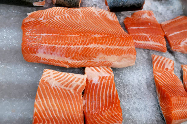 istock sliced salmon lying on the ice in the refrigerator store 1165551785