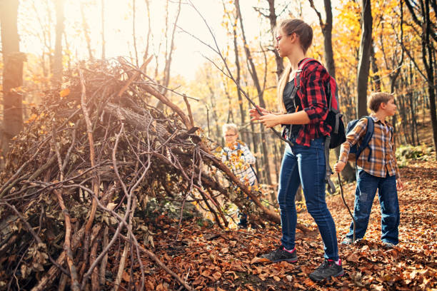 istock Children building stick shelter in autumn forest 1165551804