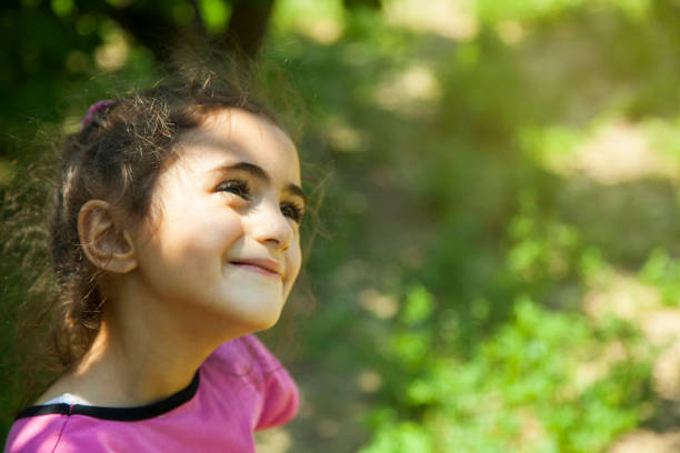 istock happy girl in garden 1165553854