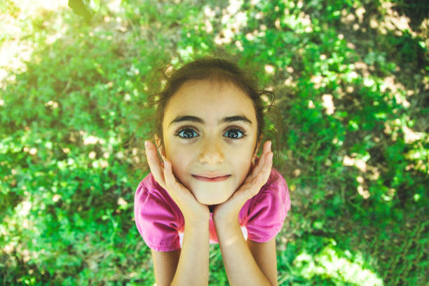 istock happy girl in garden 1165553877