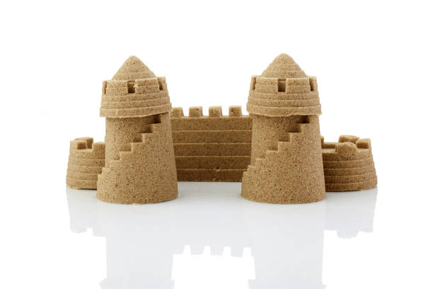 istock Sandcastle at the beach isolated over white 1165554438