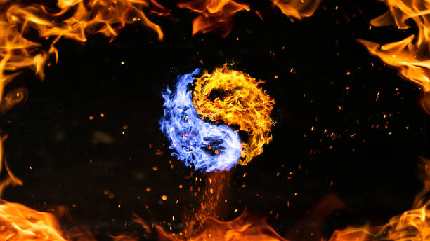 istock fire yin yang symbol, orange and blue with fire frame 1165556147