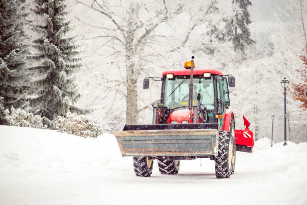 istock tractor cleans road from snow in the winter 1165556662