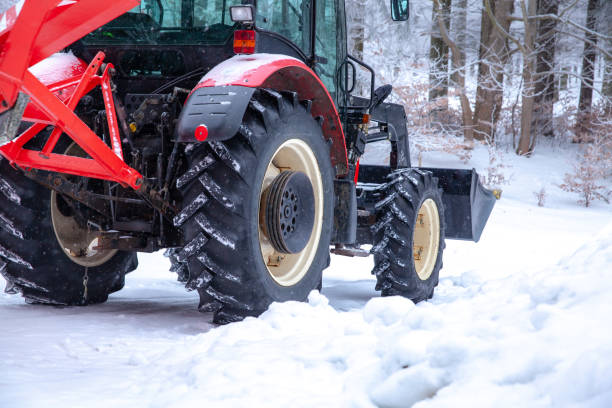 istock tractor cleans road from snow in the winter 1165556717