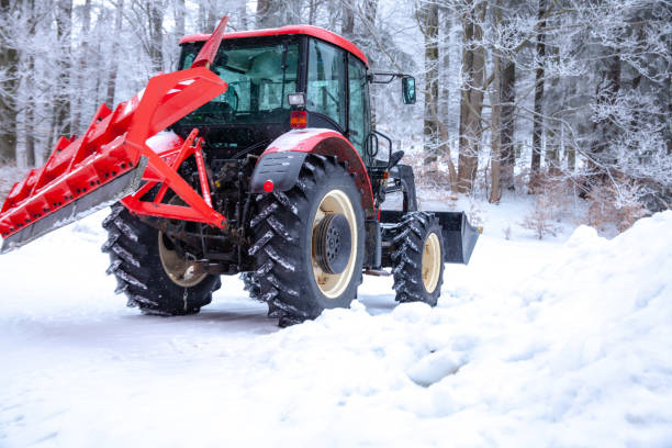 istock tractor cleans road from snow in the winter 1165558269
