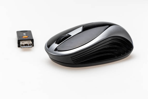 istock wireless mouse and USB dongle isolated on white background. 1165561313