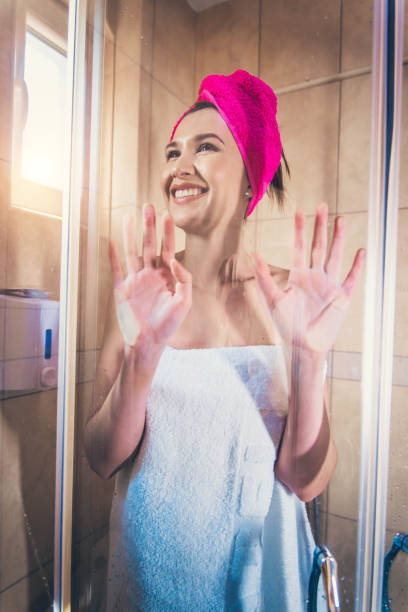 istock Young woman in shower 1165561418