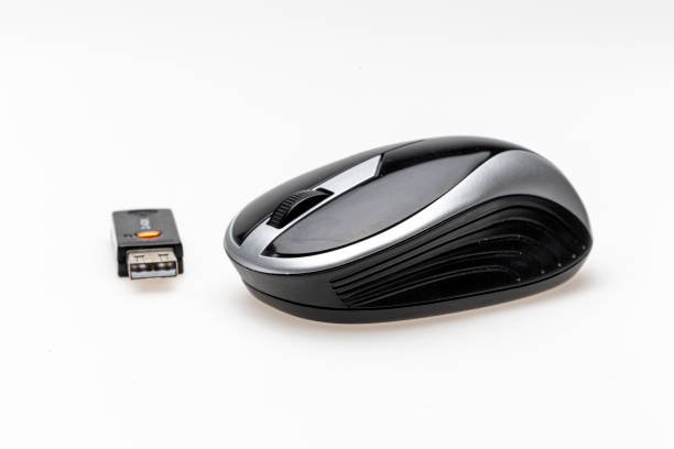 istock wireless mouse and USB dongle isolated on white background. 1165561431