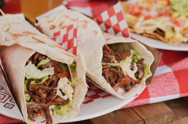 istock Burritos stuffed with meat and vegetables. Picnic lunch. 1165563527