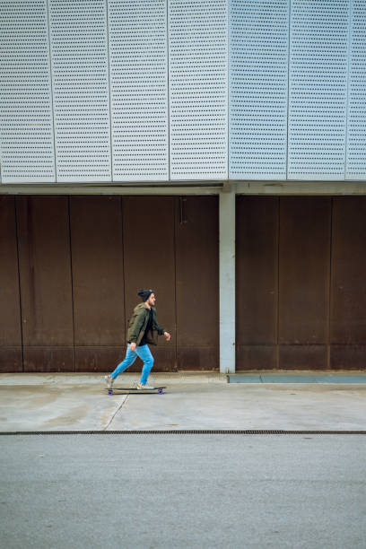 istock Man having fun with a longboard in Barcelona 1165566042