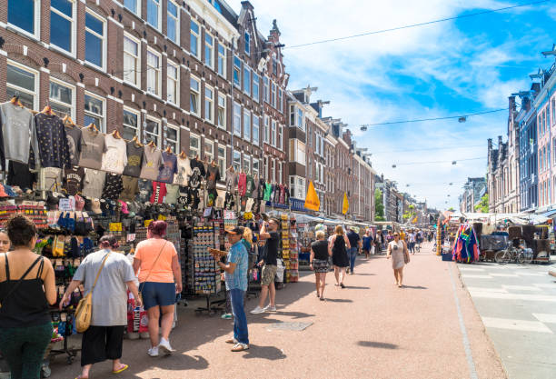 Amsterdam, North Holland / Netherlands - June 24th, 2019: People at Albert Cuyp Market shops
