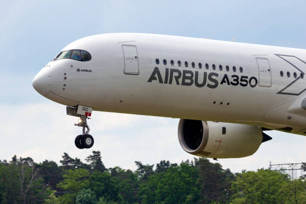 Airbus A350 XWB passenger plane Berlin - Jun 2, 2016: Airbus A350 XWB passenger plane landing on Berlin-Schoneveld airport during the ILA Airshow airshow photos stock pictures, royalty-free photos & images