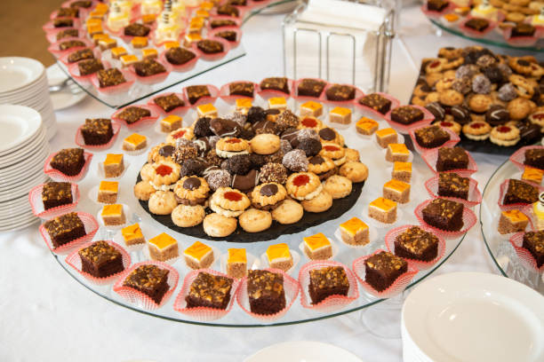istock Delicious decorated candy bar, sweets on a buffet table at a luxury event or celebration. Catering food 1165572285