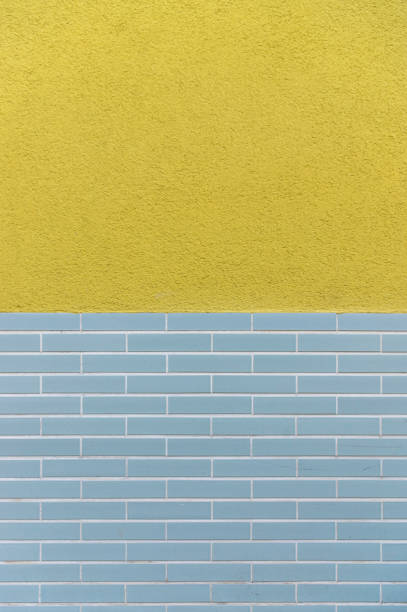istock Facade tiled base, partly plastered with design from the 60s as background 1165573310