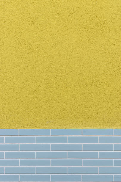 istock Facade tiled base, partly plastered with design from the 60s as background 1165573335