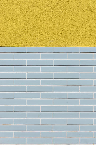 istock Facade tiled base, partly plastered with design from the 60s as background 1165573441