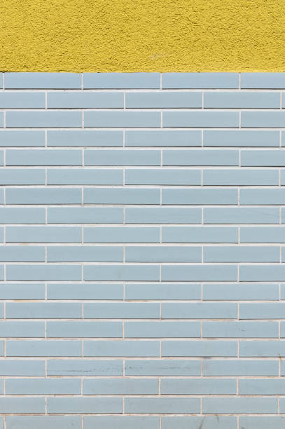 istock Facade tiled base, partly plastered with design from the 60s as background 1165573481